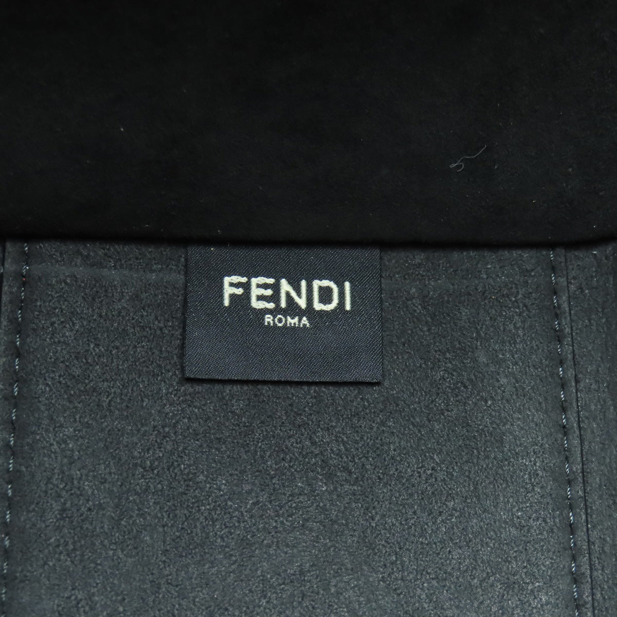 Fendi label on a black background
