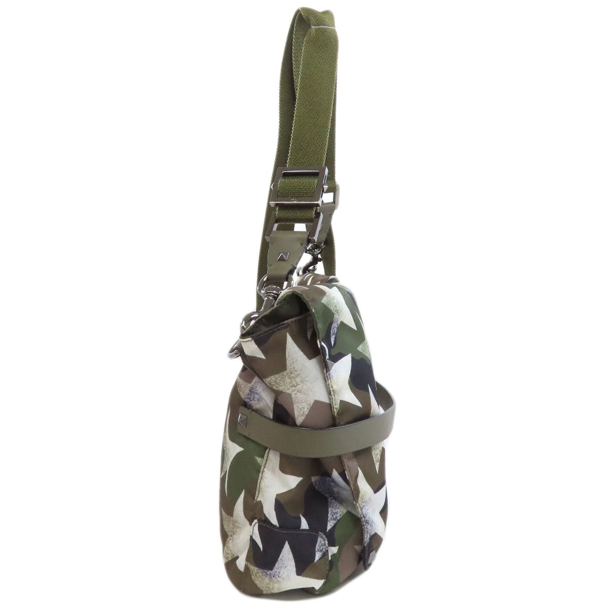 Camouflage-patterned bag with a green strap on a white background