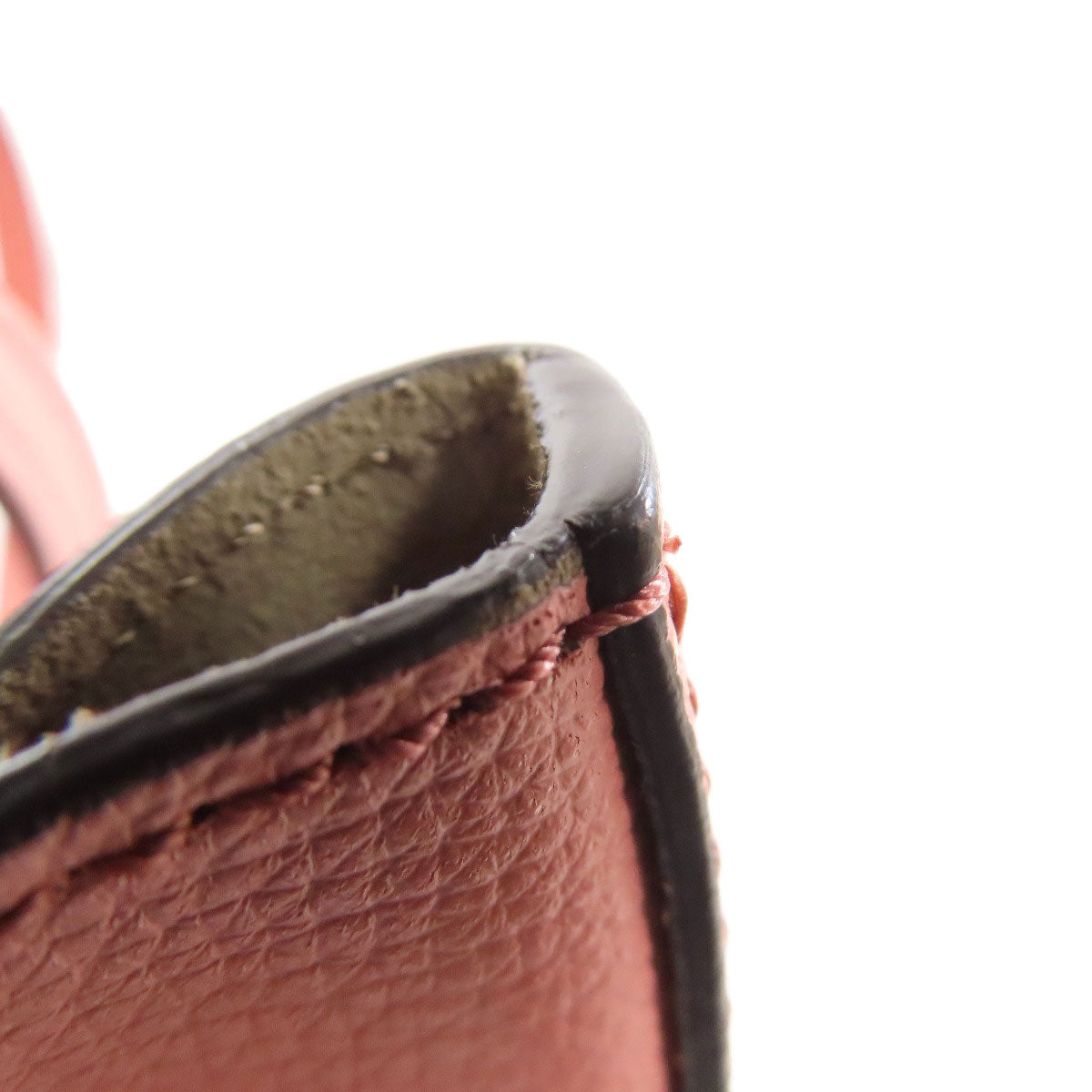 Close-up of a brown leather product with a white background