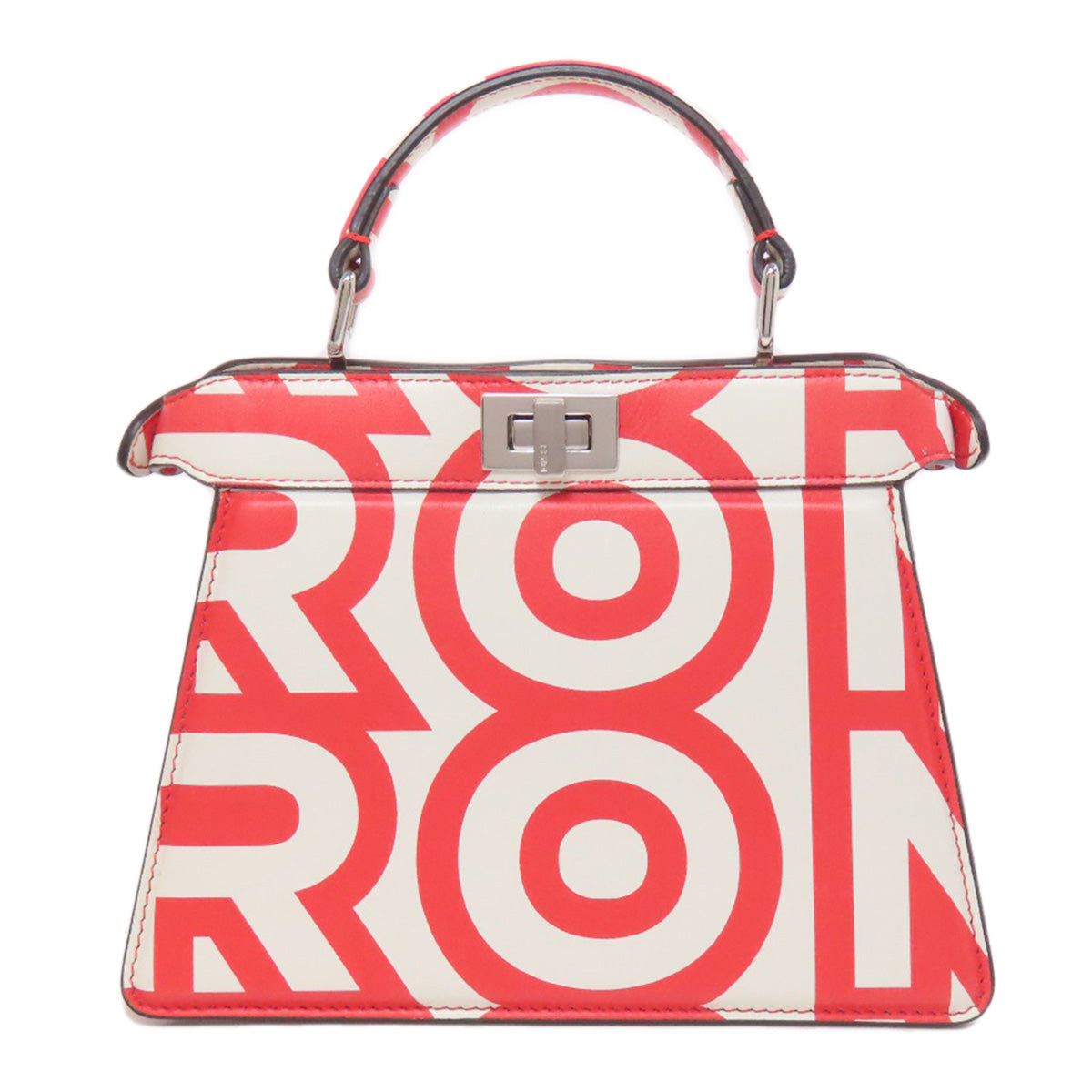 Handbag with red and white geometric pattern on a white background