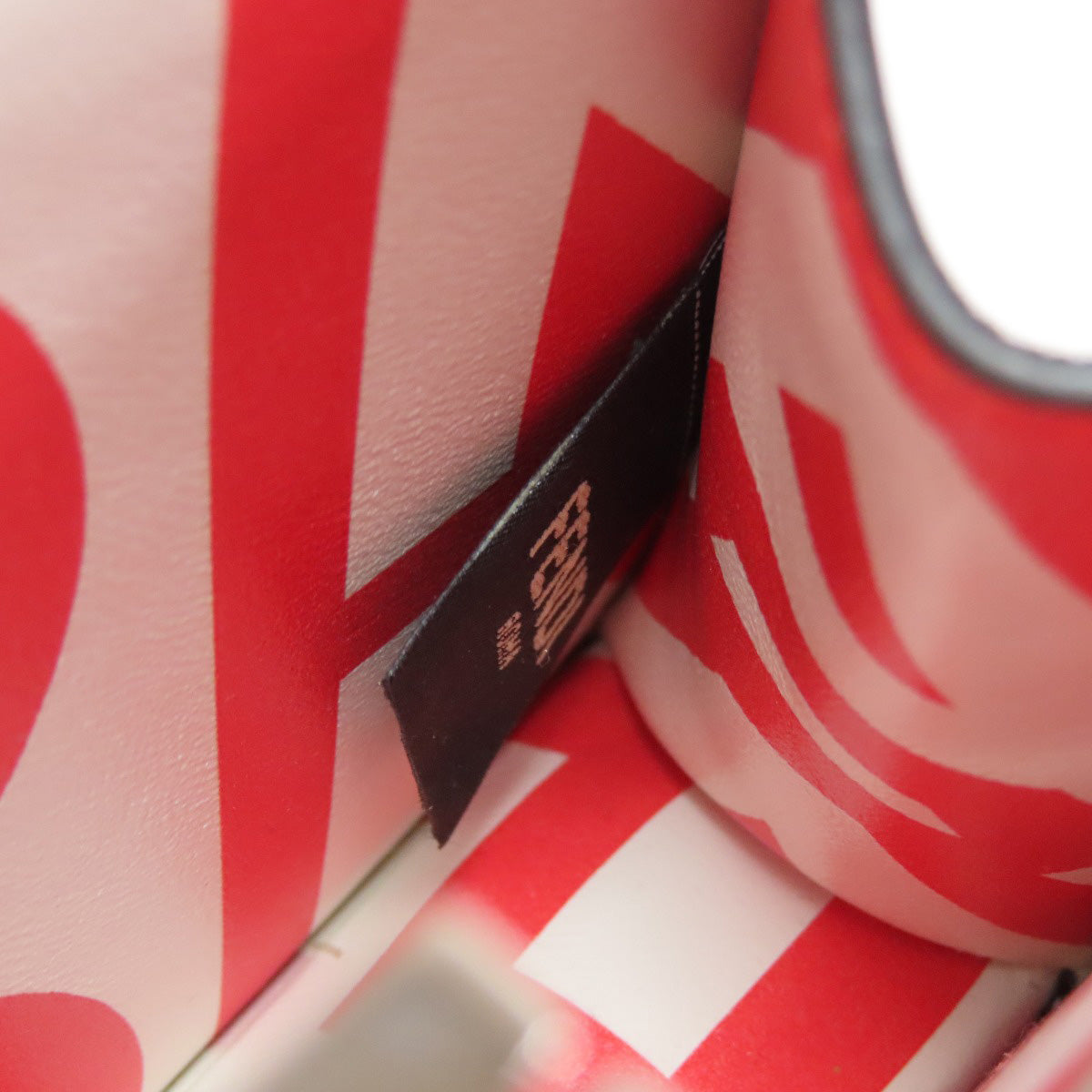 Red and white product with a black label on a red background