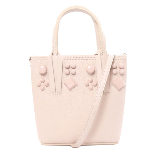 Pink handbag with geometric designs on a white background