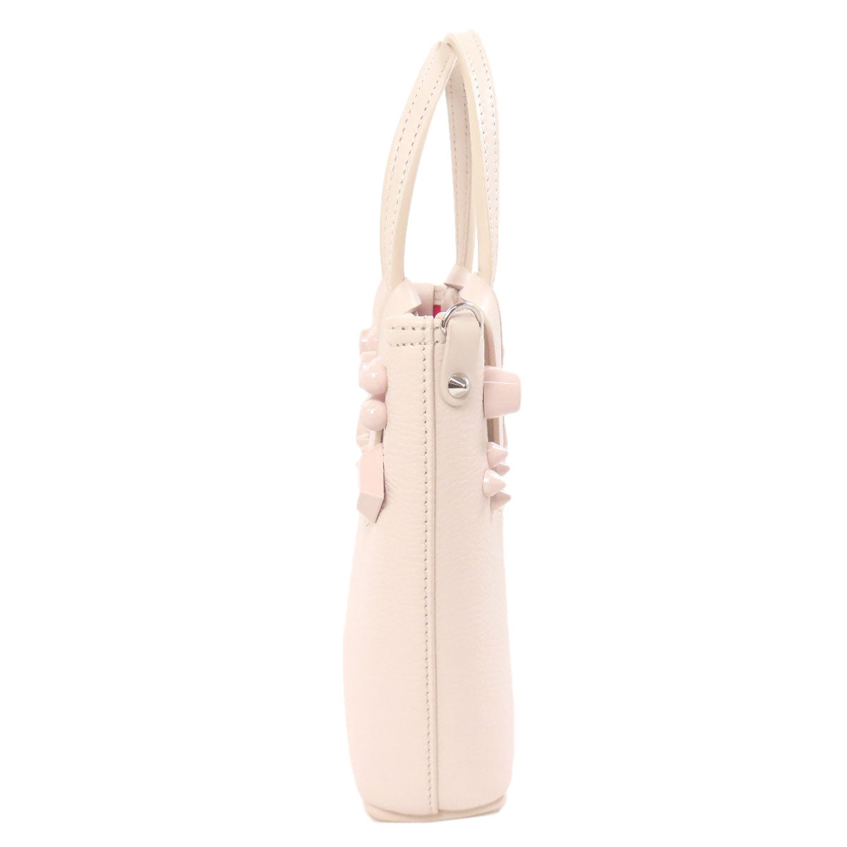 Pink handbag with a strap on a white background