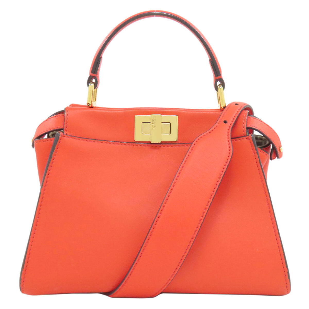 Orange handbag with a gold clasp on a white background