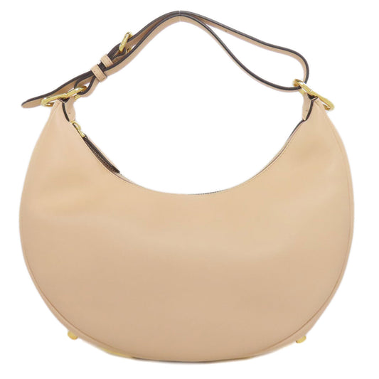 Beige handbag with a gold clasp on a white background