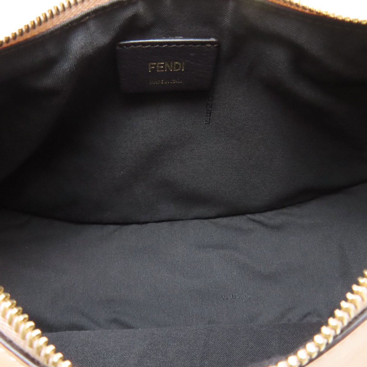 Fendi logo on black fabric interior of a bag