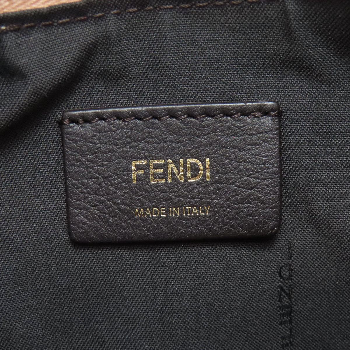 Fendi label on a black fabric background