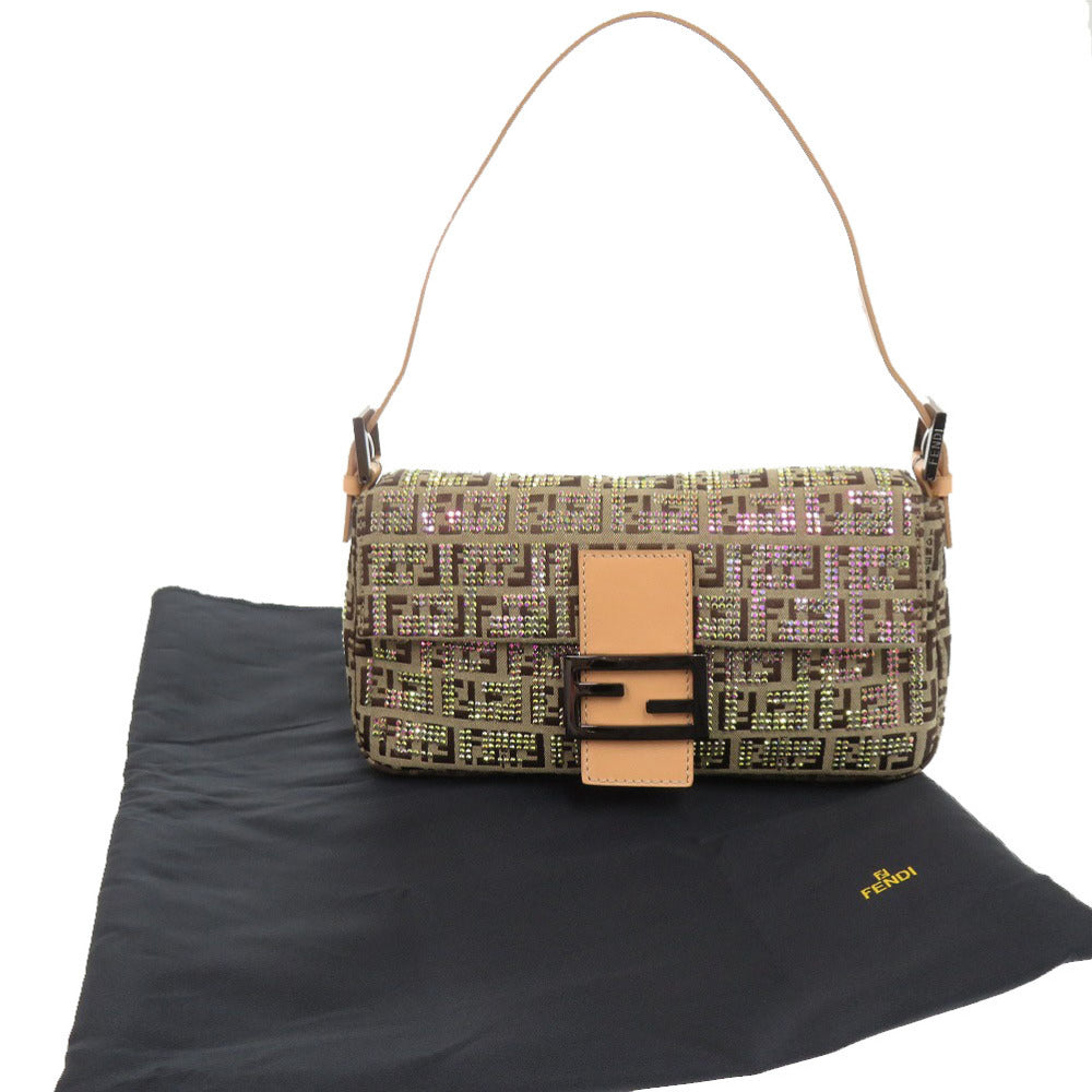 Designer handbag with a patterned design on a black surface