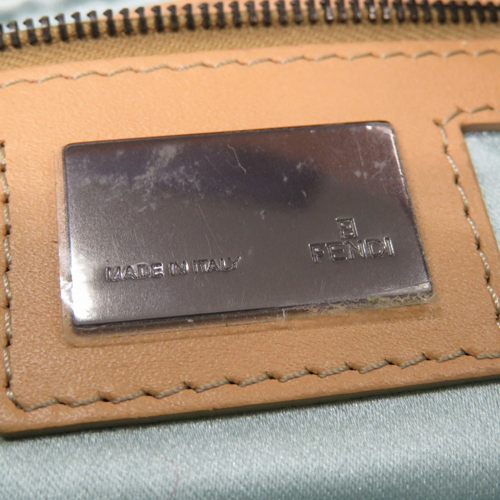 Close-up of a brown leather wallet with 'Made in Italy' and 'Ferragamo' branding.