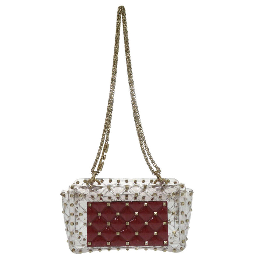Handbag with red quilted design and gold chain strap on a white background