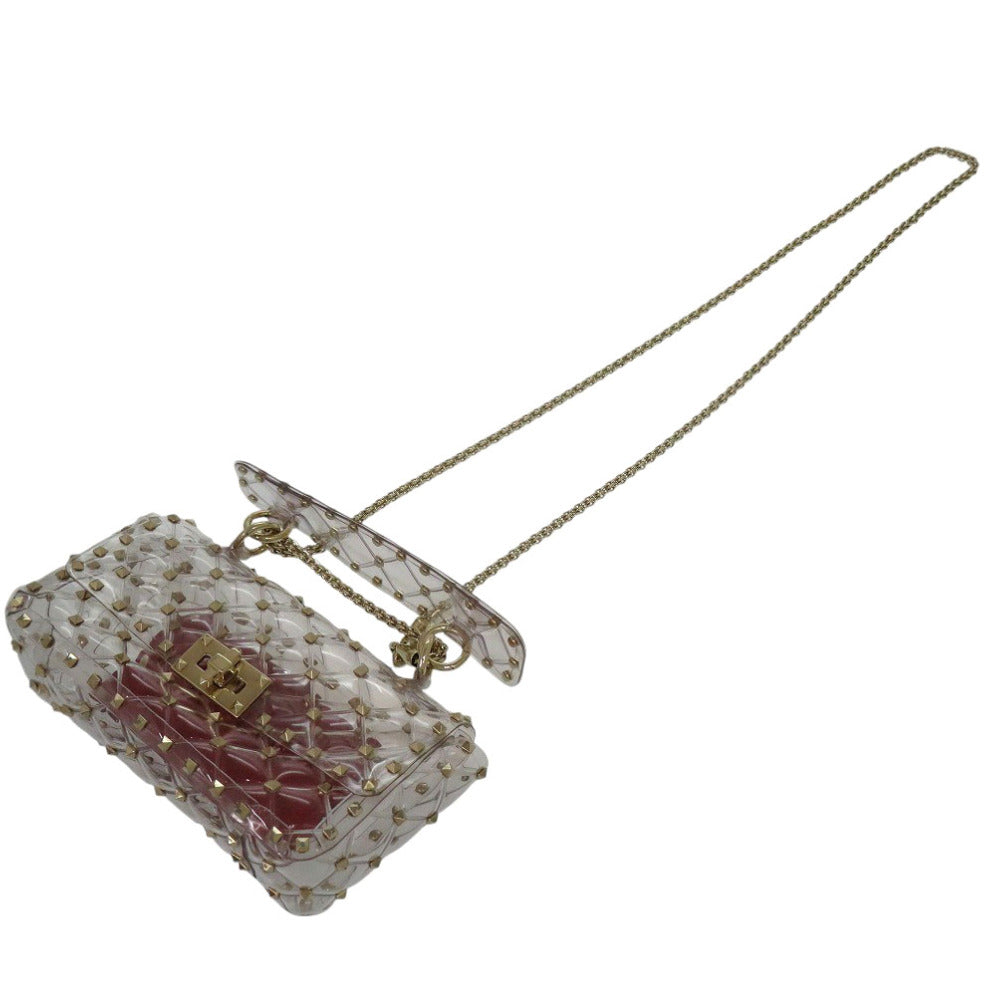 Transparent handbag with floral design and gold accents on a white background
