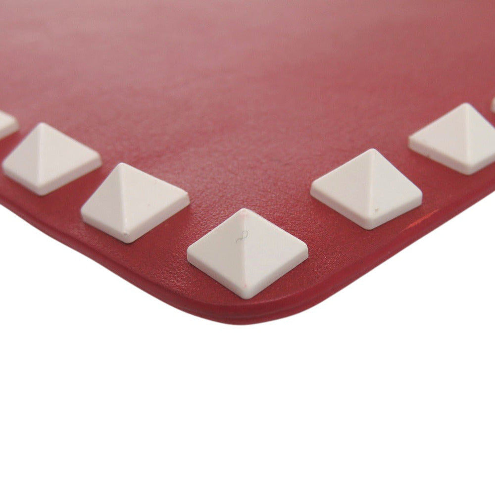 Red mat with white pyramid-shaped protrusions on a white background