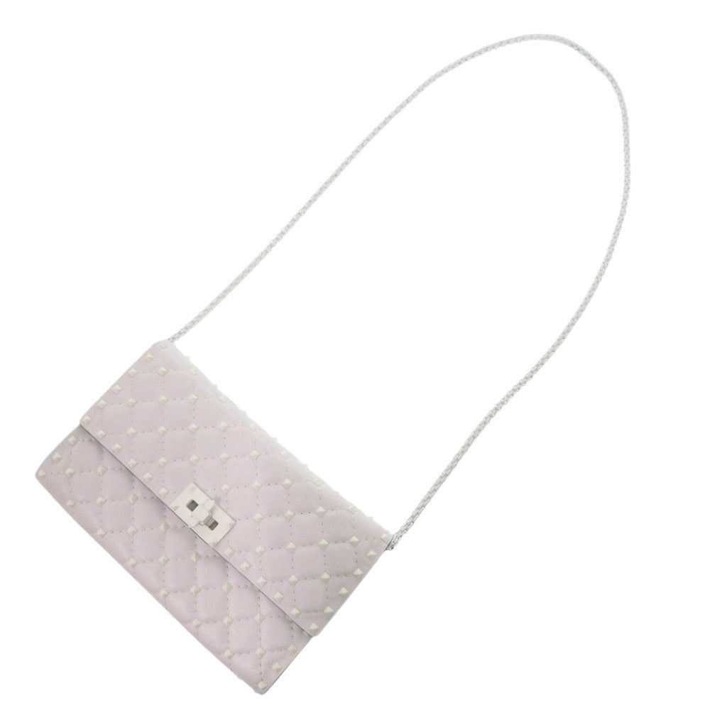 Light gray clutch bag with a strap on a white background