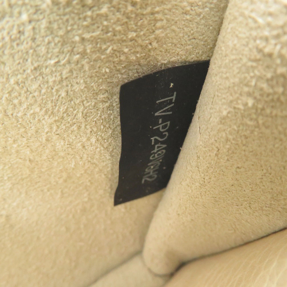 Close-up of a beige fabric with a black label displaying text.