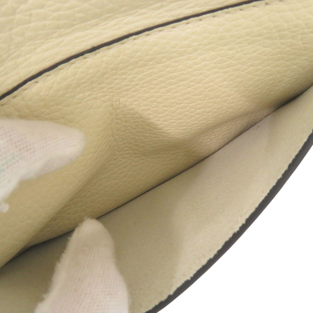 Close-up of beige leather with a black line detail