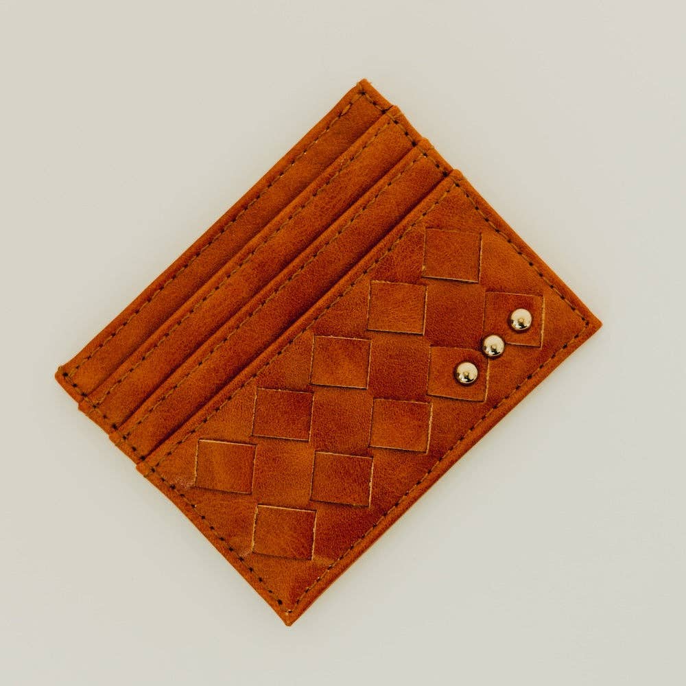 Brown leather cardholder with woven pattern on a light gray background
