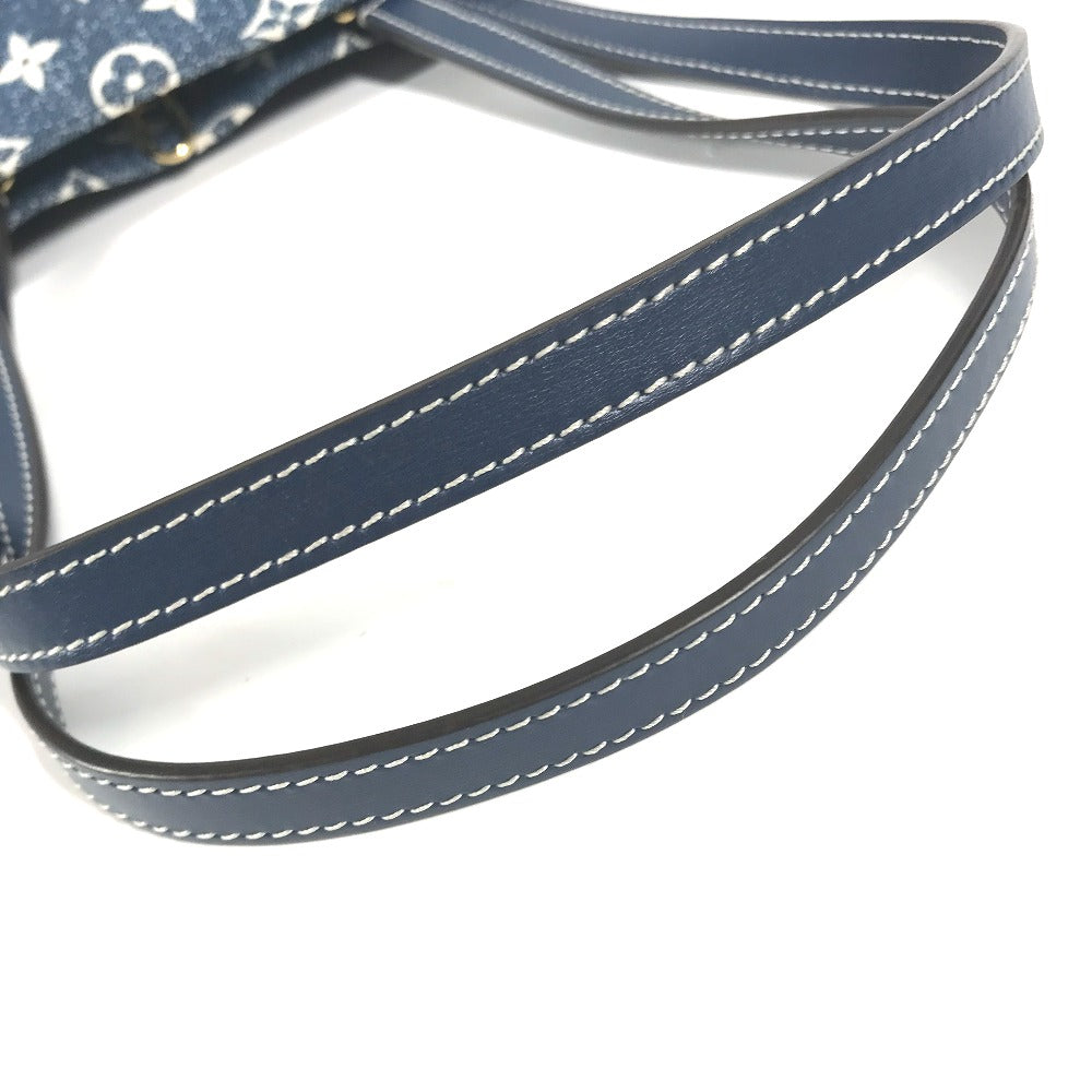 Close-up of a blue leather strap with white stitching on a white background