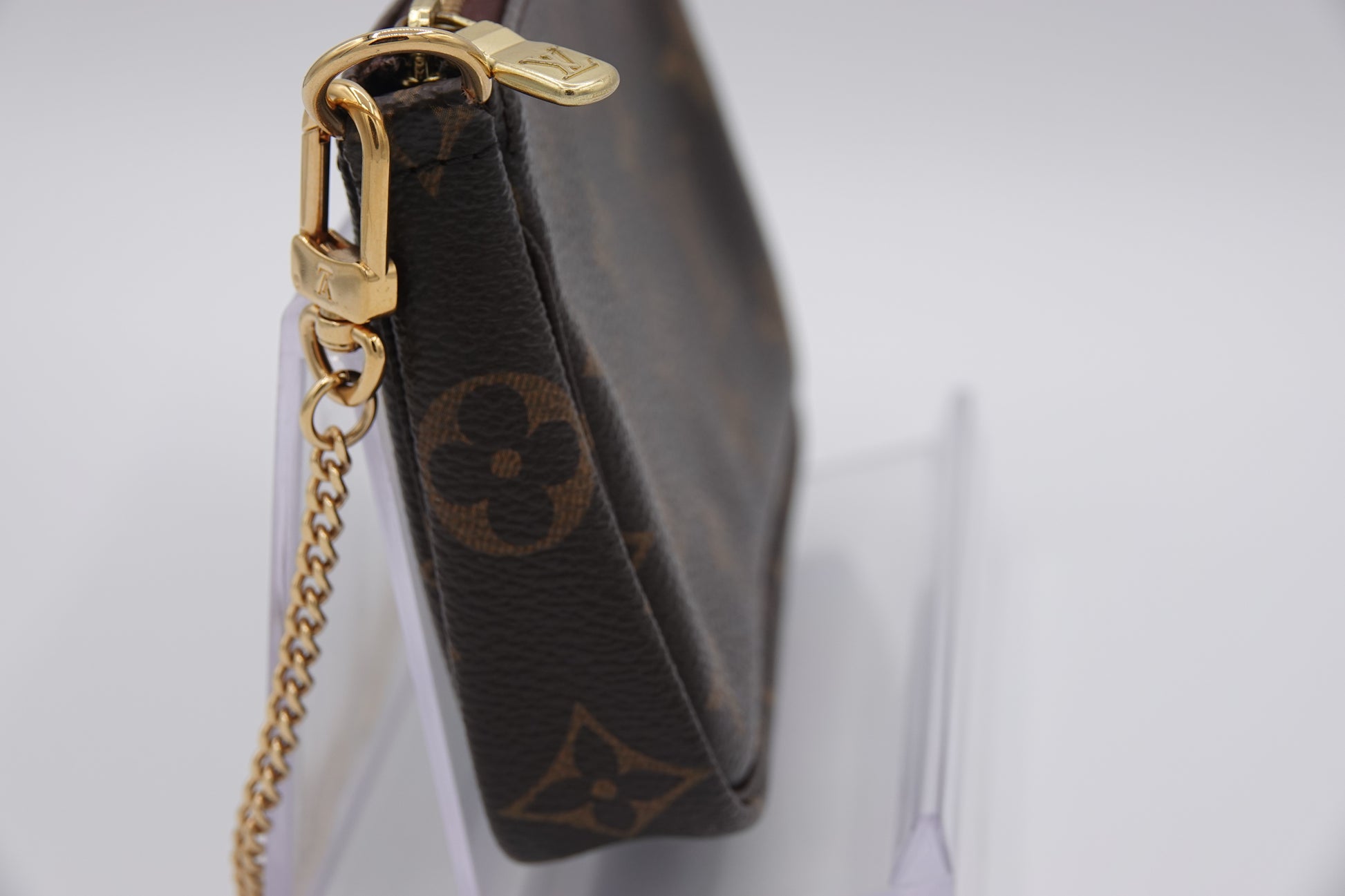 side Louis Vuitton brown canvas  Monogram Mini Pochette Accessories gold hardware