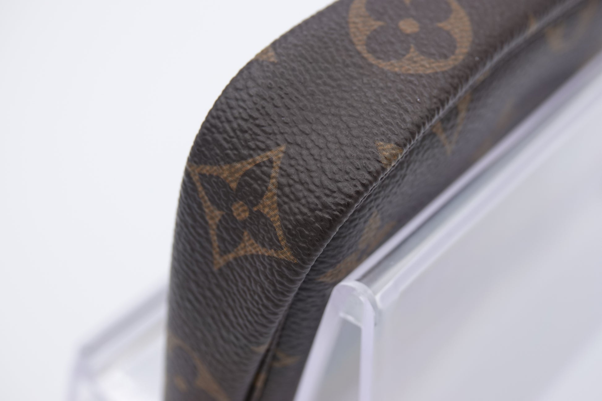 corner Louis Vuitton brown canvas  Monogram Mini Pochette Accessories gold hardware