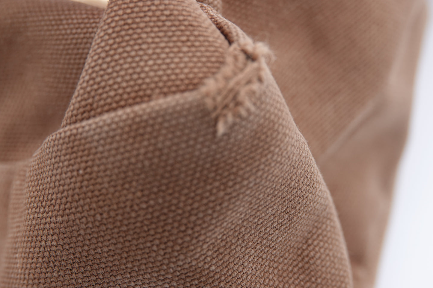 Close-up of brown fabric with a textured pattern