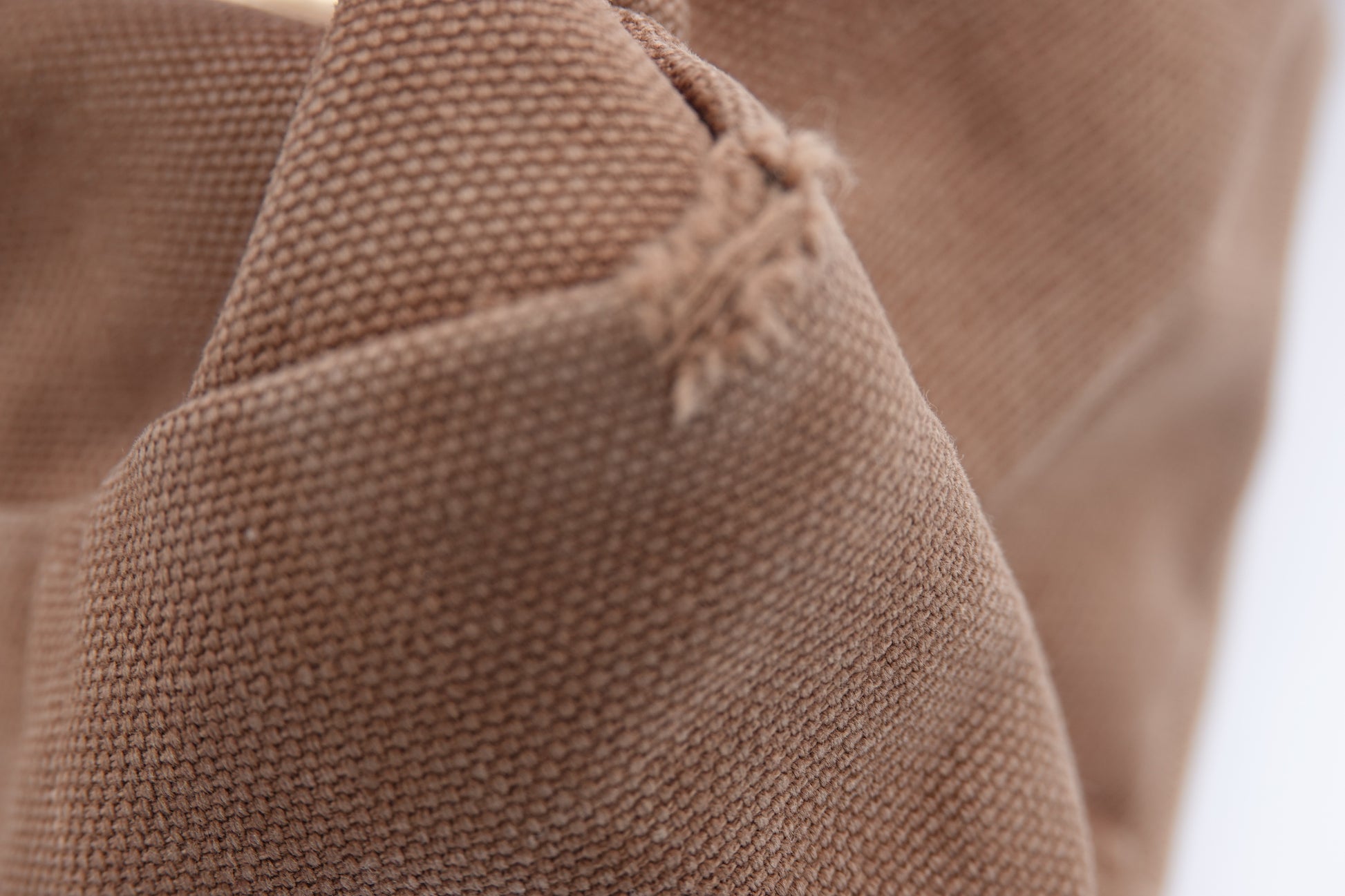 Close-up of brown fabric with a textured pattern