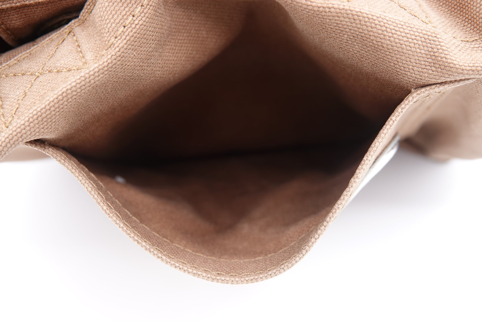Close-up of a brown leather bag on a white background