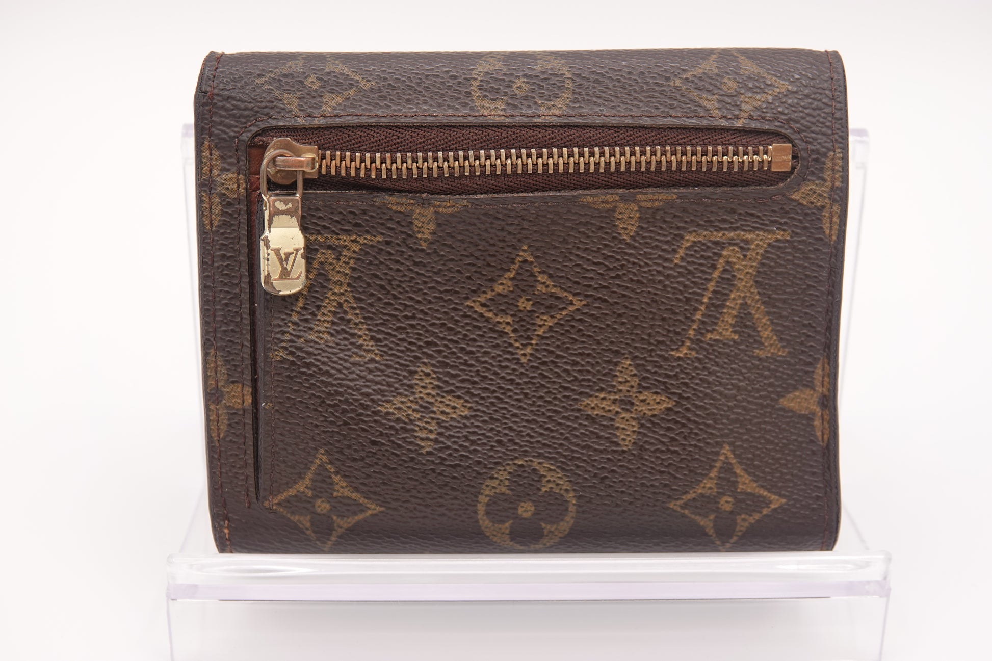 Brown wallet with gold zipper and logo on a white background