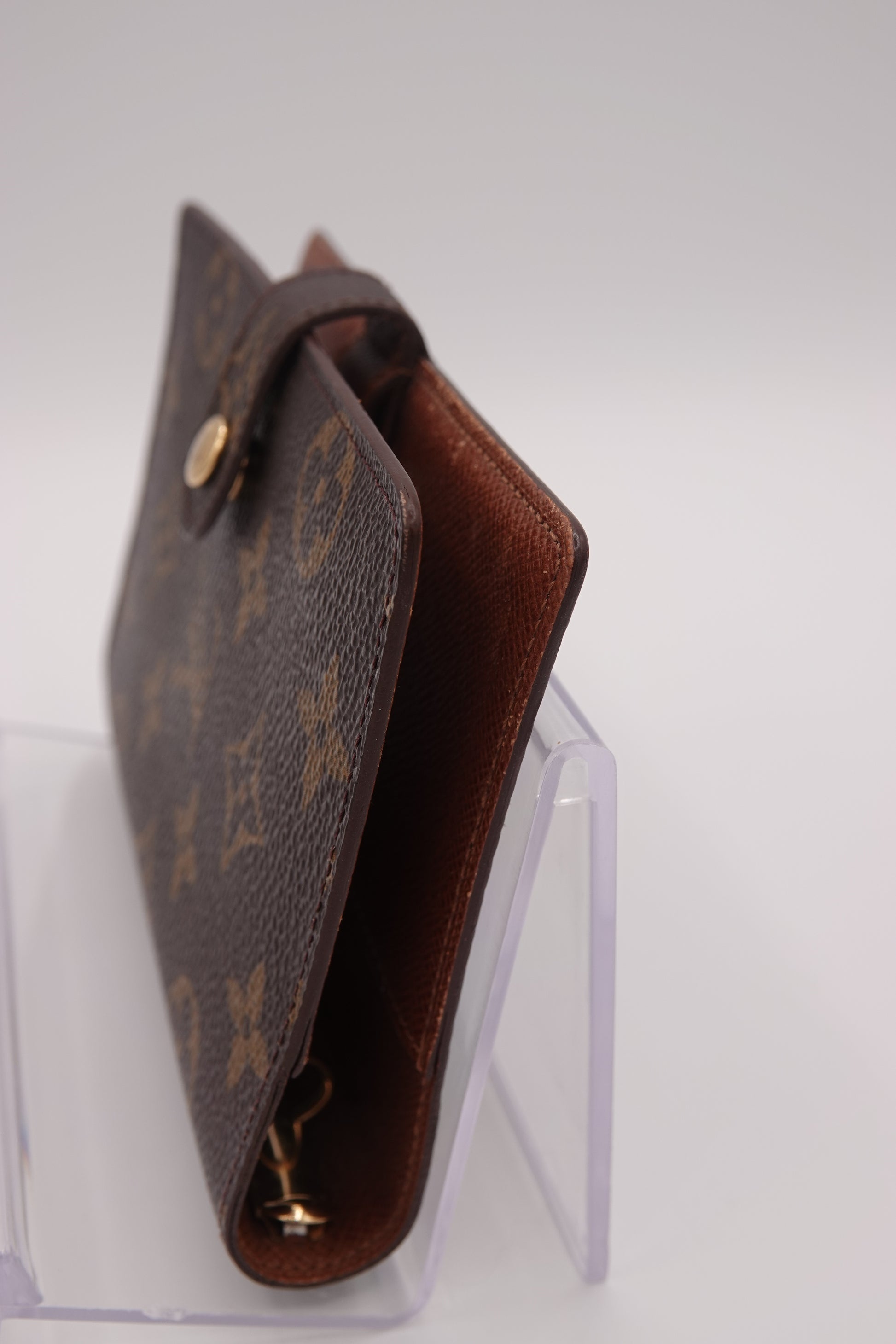 Louis Vuitton wallet on a white background
