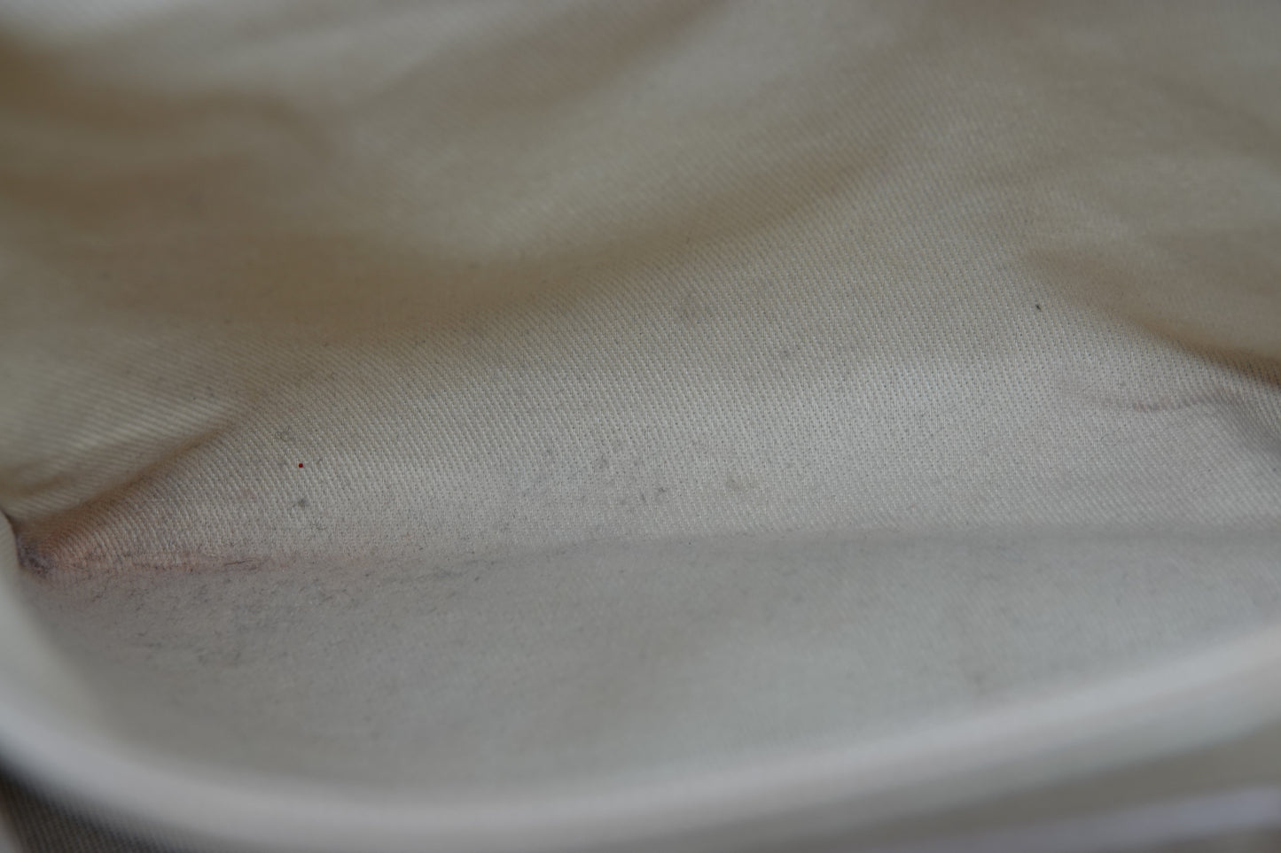 Close-up of a textured beige fabric surface