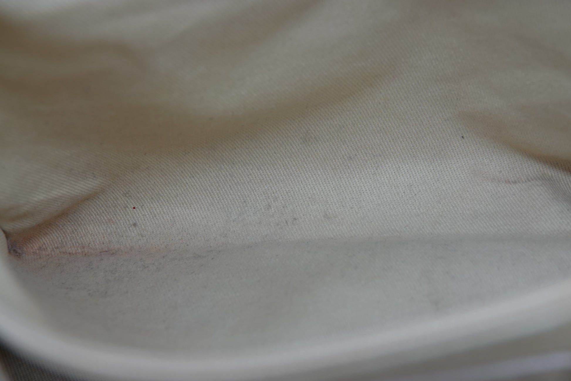 Close-up of a textured beige fabric surface