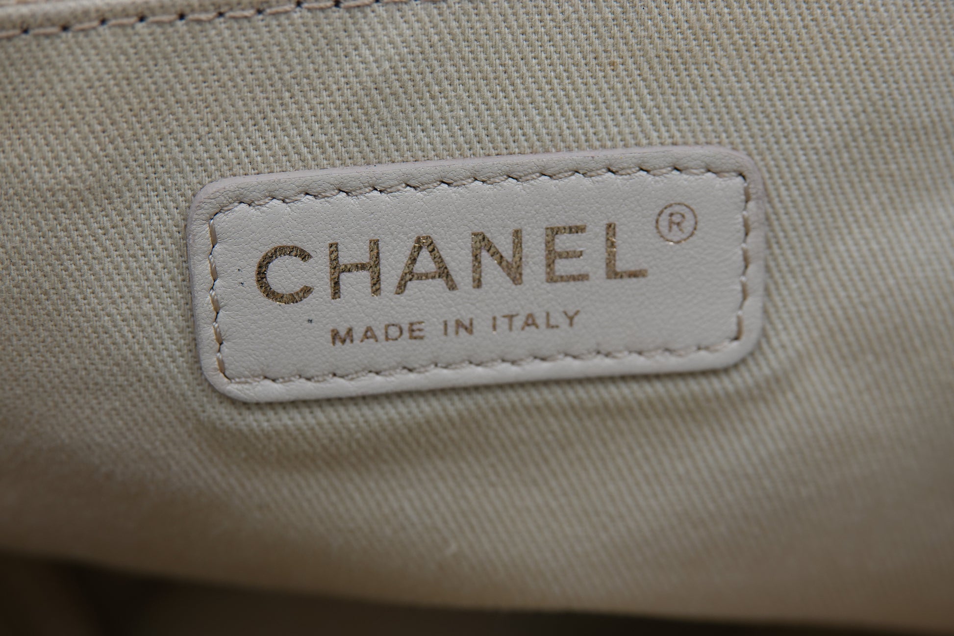 Chanel label on a beige fabric background