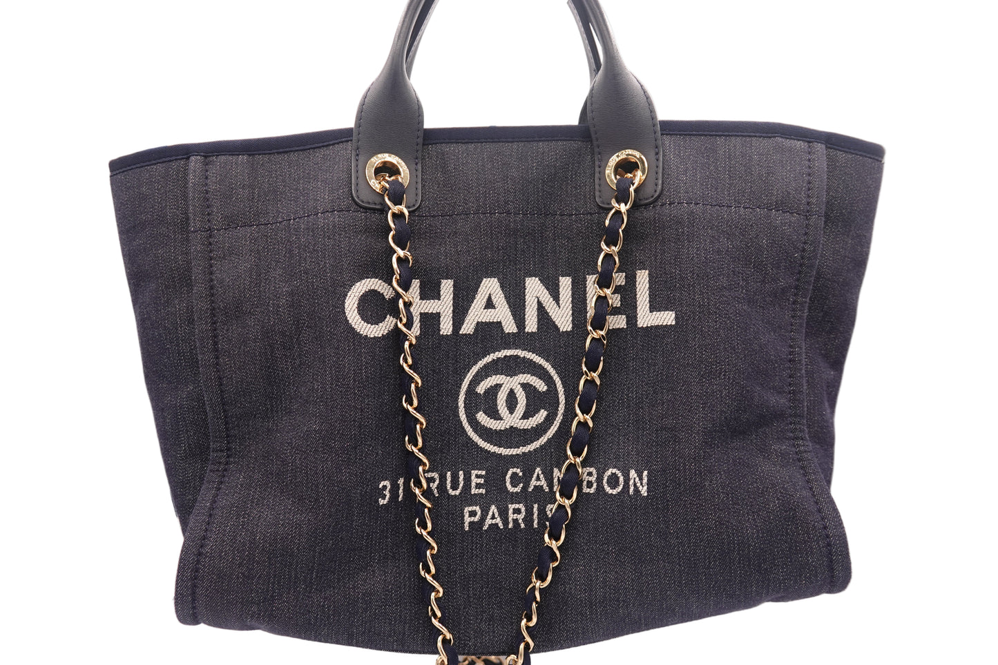 Chanel handbag with gold chain on a white background