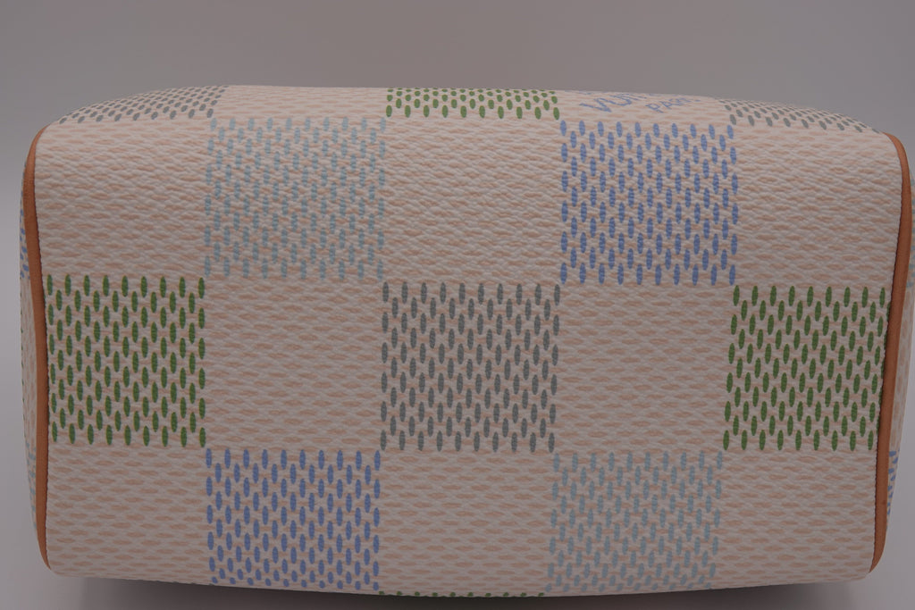 Rectangular ottoman with a patchwork pattern on a gray background