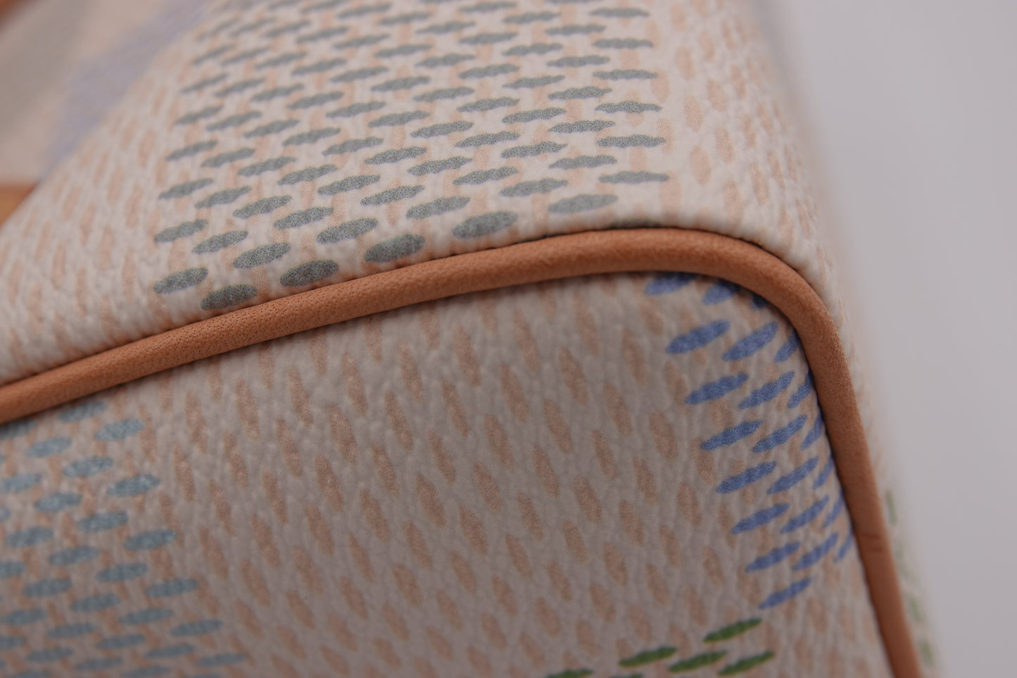 Close-up of a textured fabric with a brown border