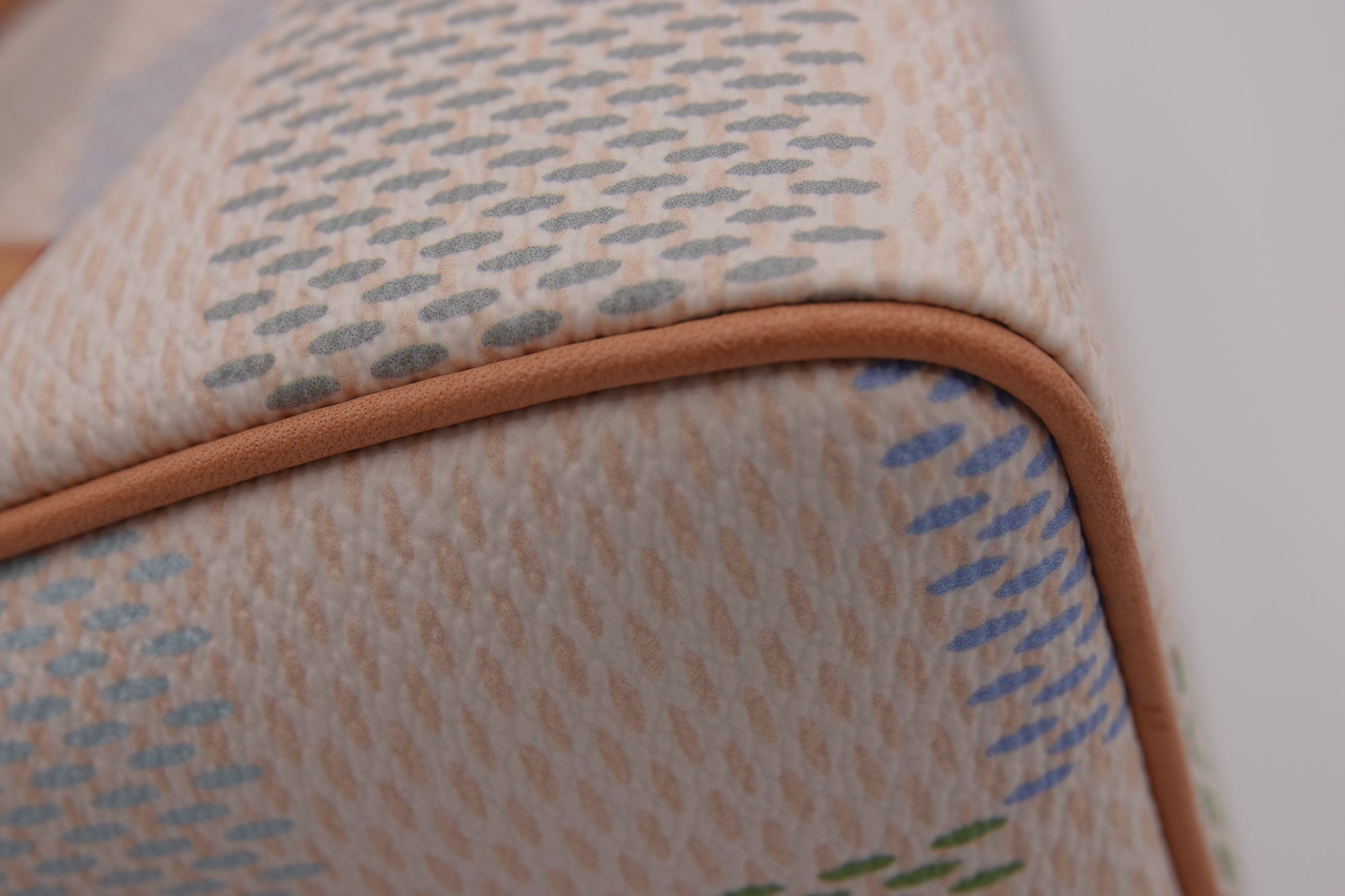 Close-up of a textured fabric with a brown border