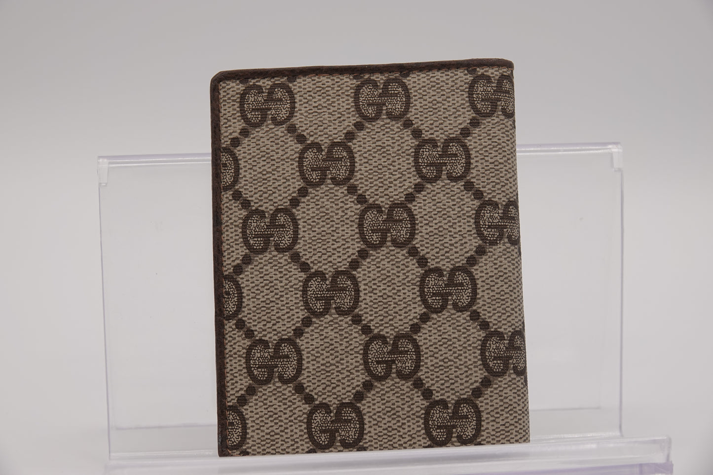 Gucci patterned mat on a glass surface