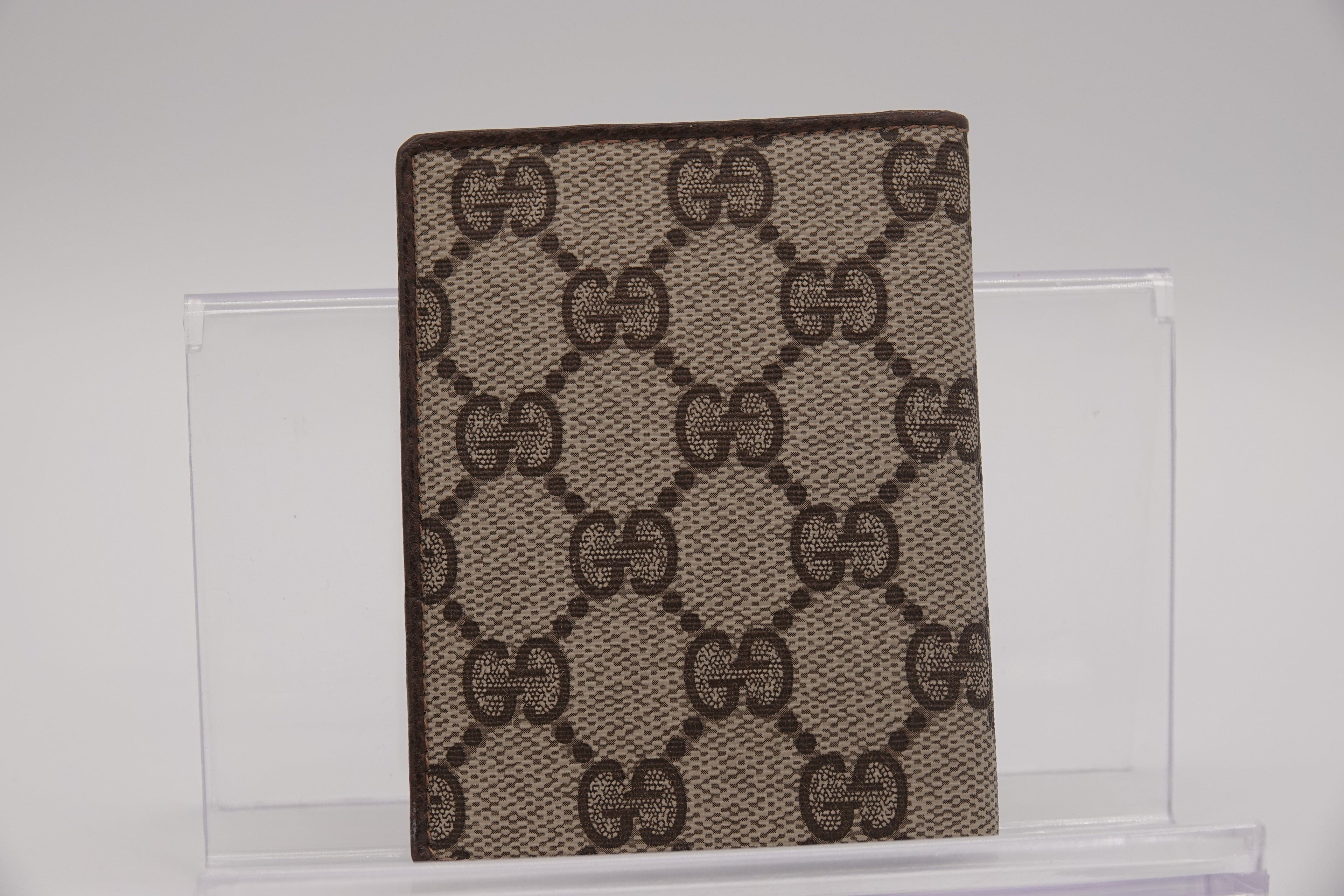 Gucci patterned mat on a glass surface