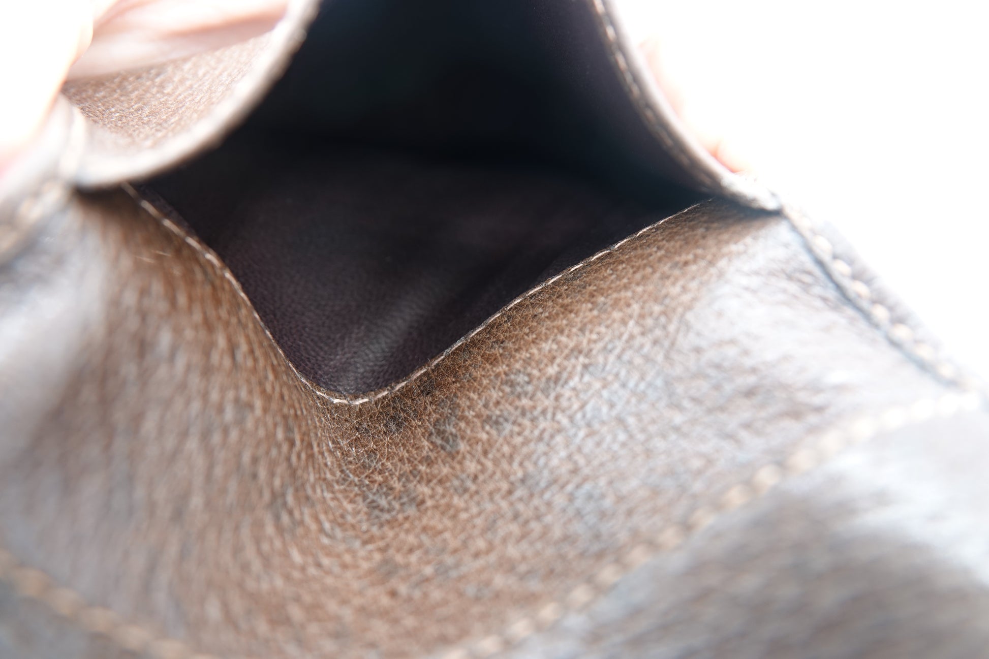 Close-up of a brown leather shoe with visible texture