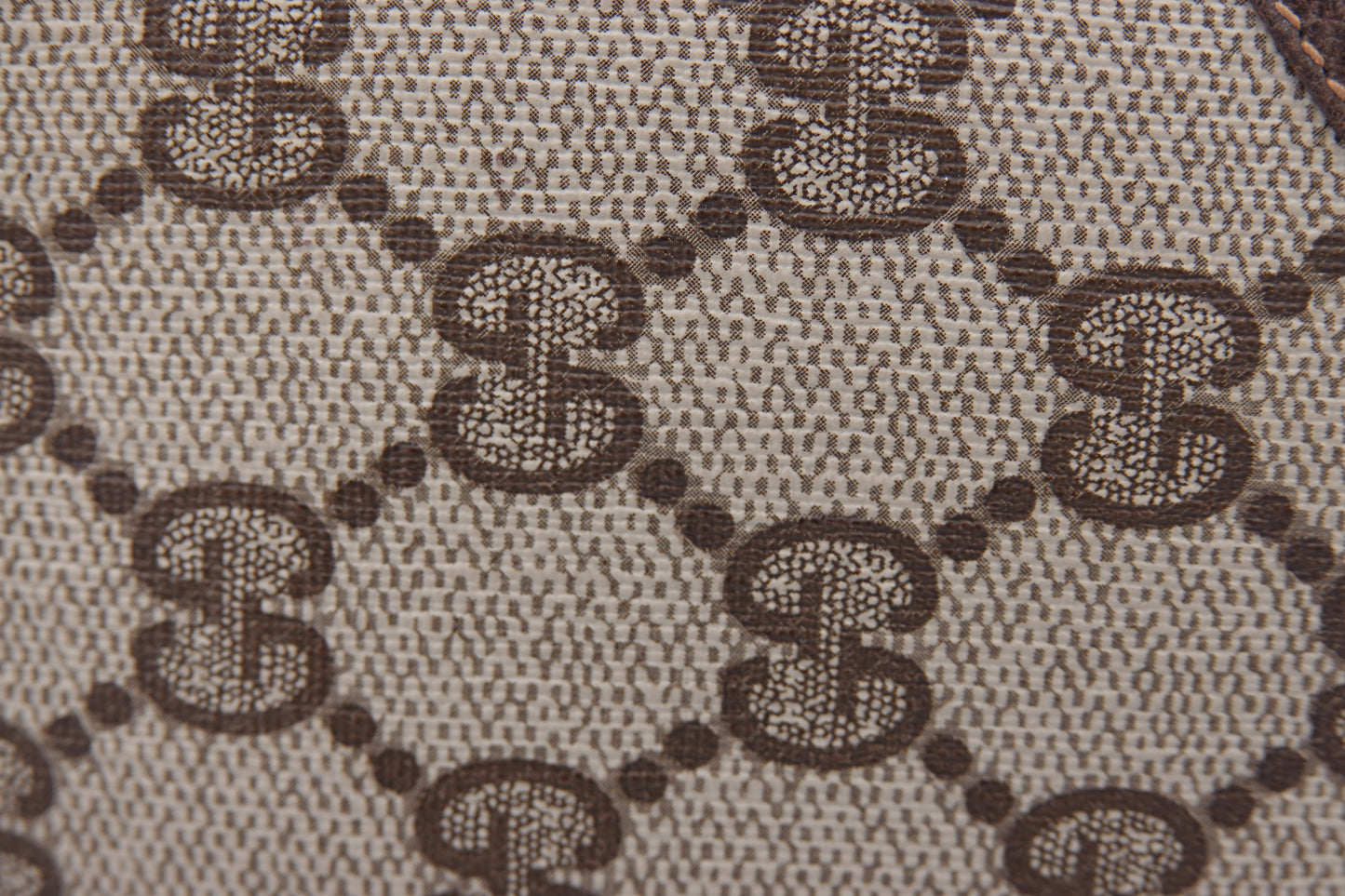 Close-up of a patterned fabric with a repeated design.