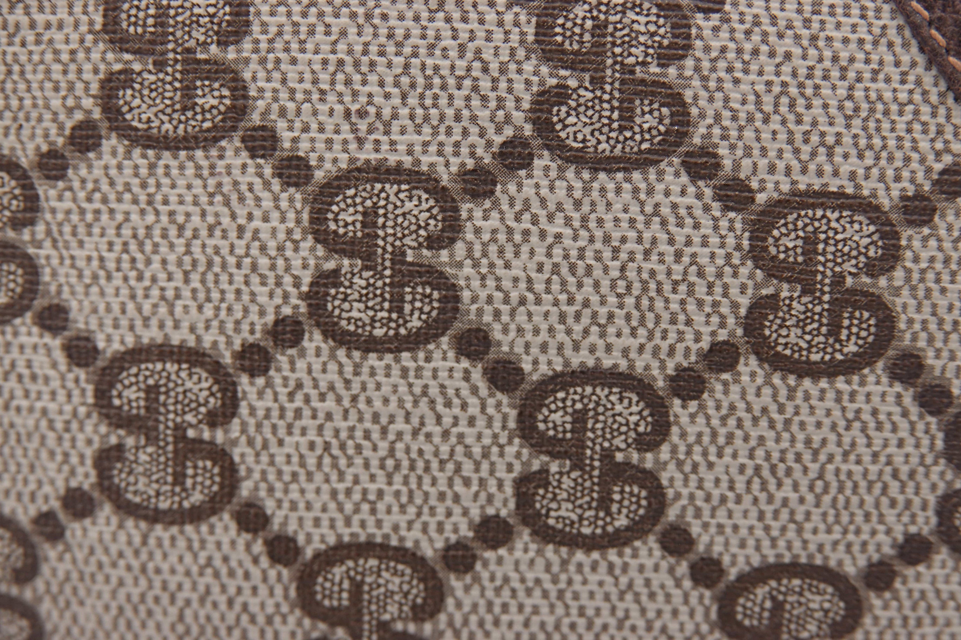Close-up of a patterned fabric with a repeated design.