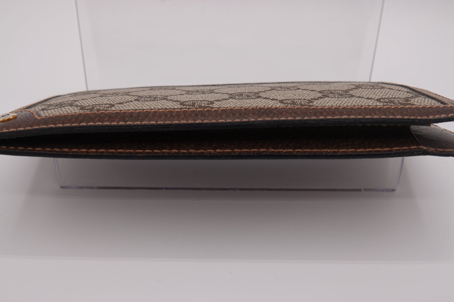 Brown textured pouch on a white background
