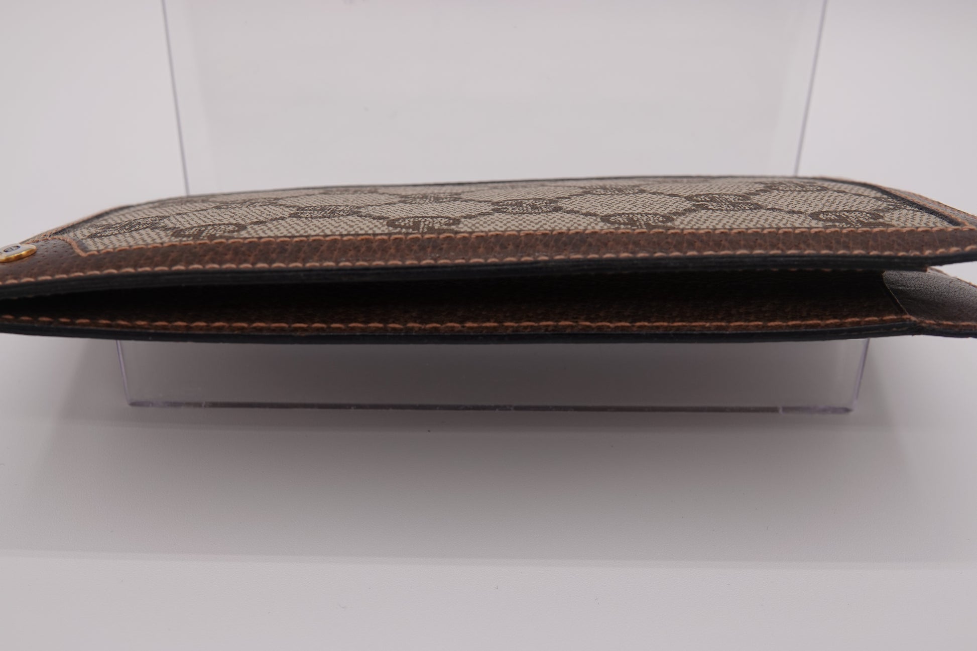 Brown textured pouch on a white background