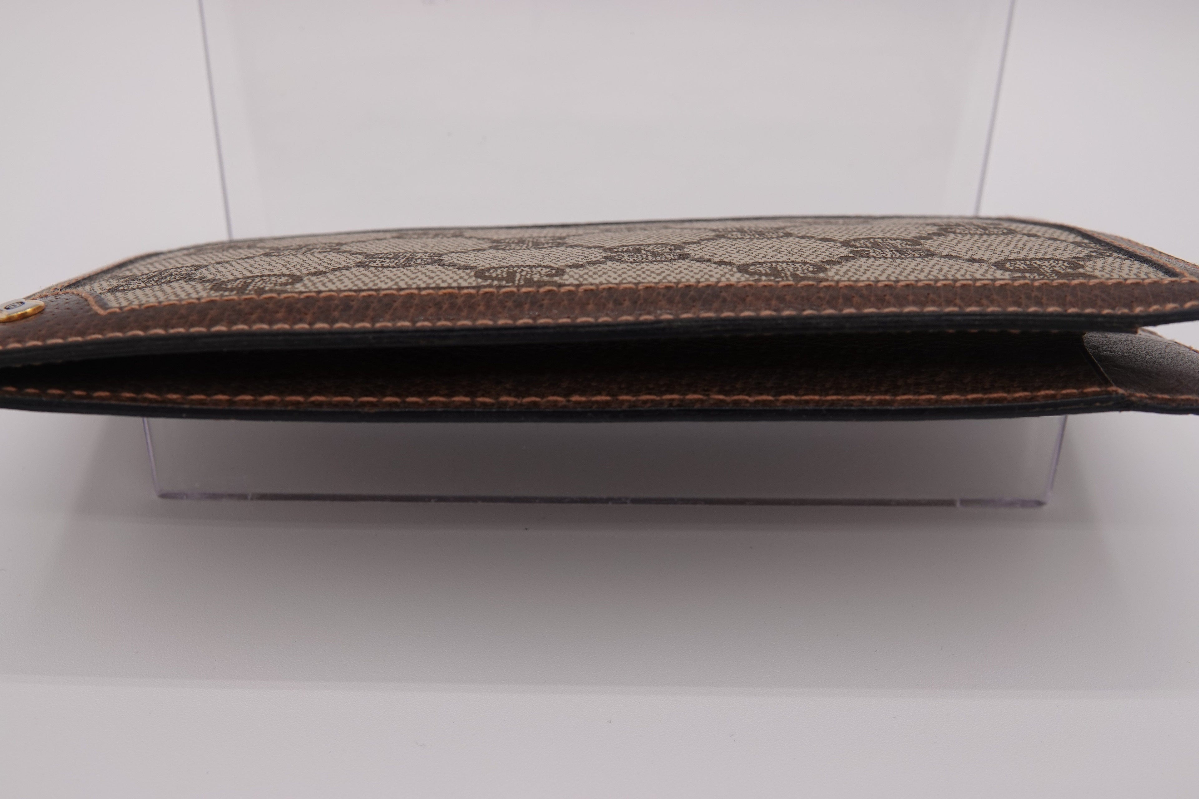 Brown textured pouch on a white background