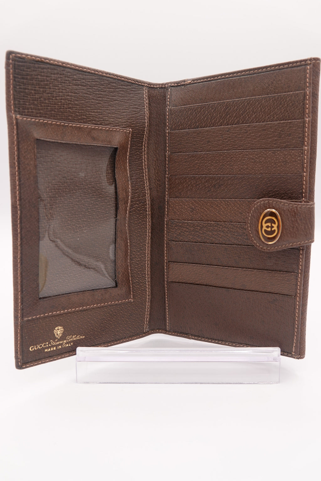 Brown leather wallet with a visible brand logo on a white background