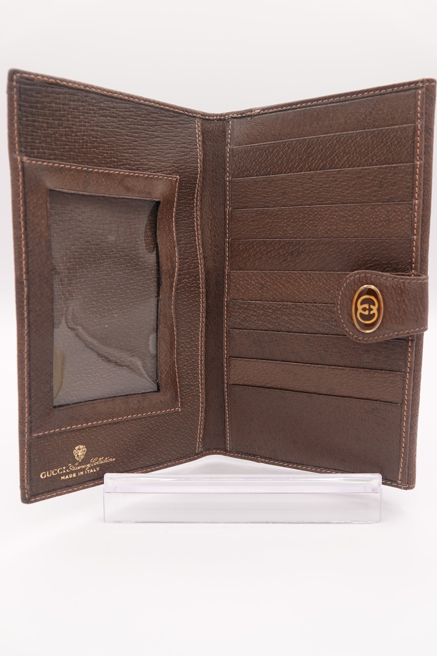 Brown leather wallet with a visible brand logo on a white background