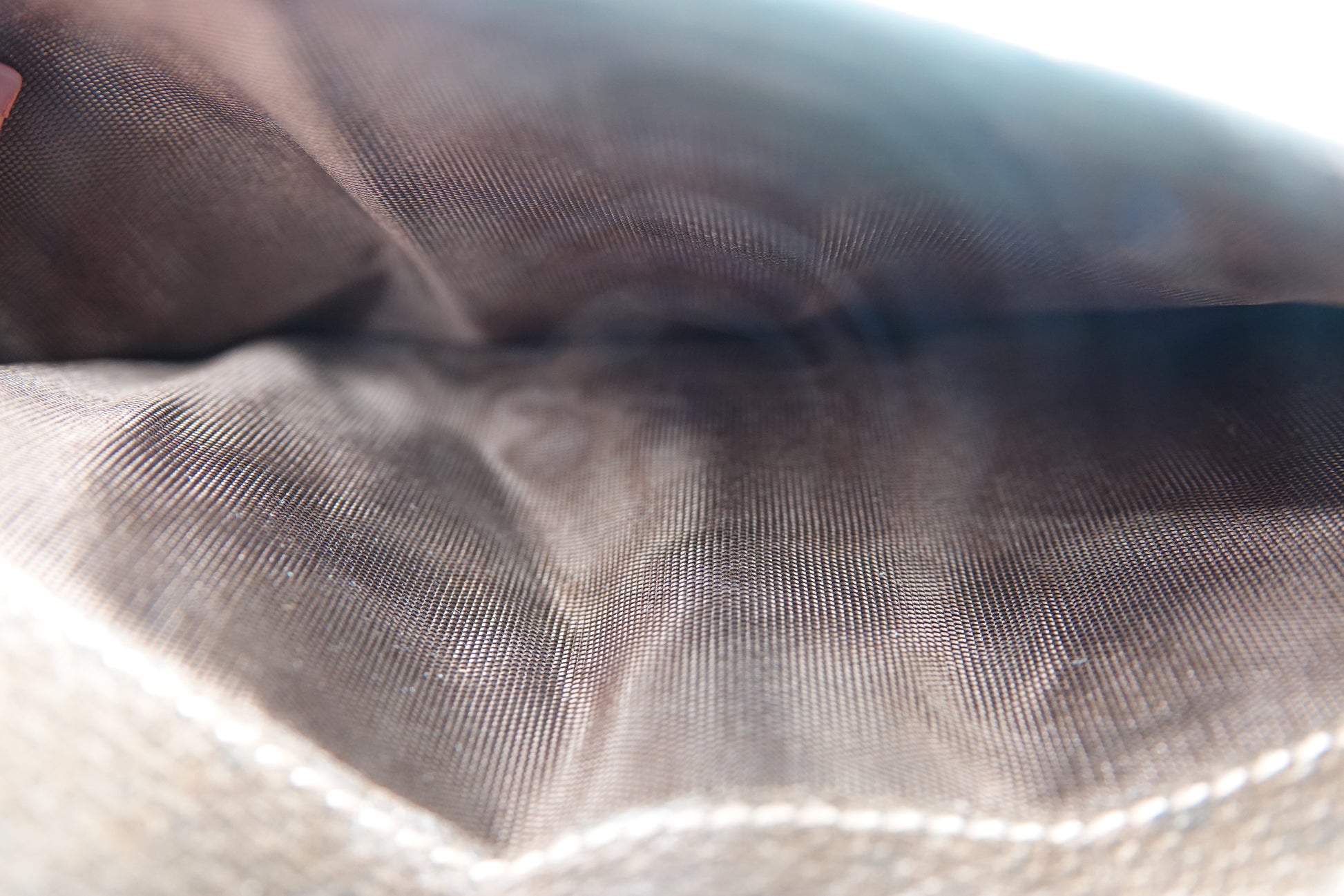 Close-up of a textured brown fabric surface