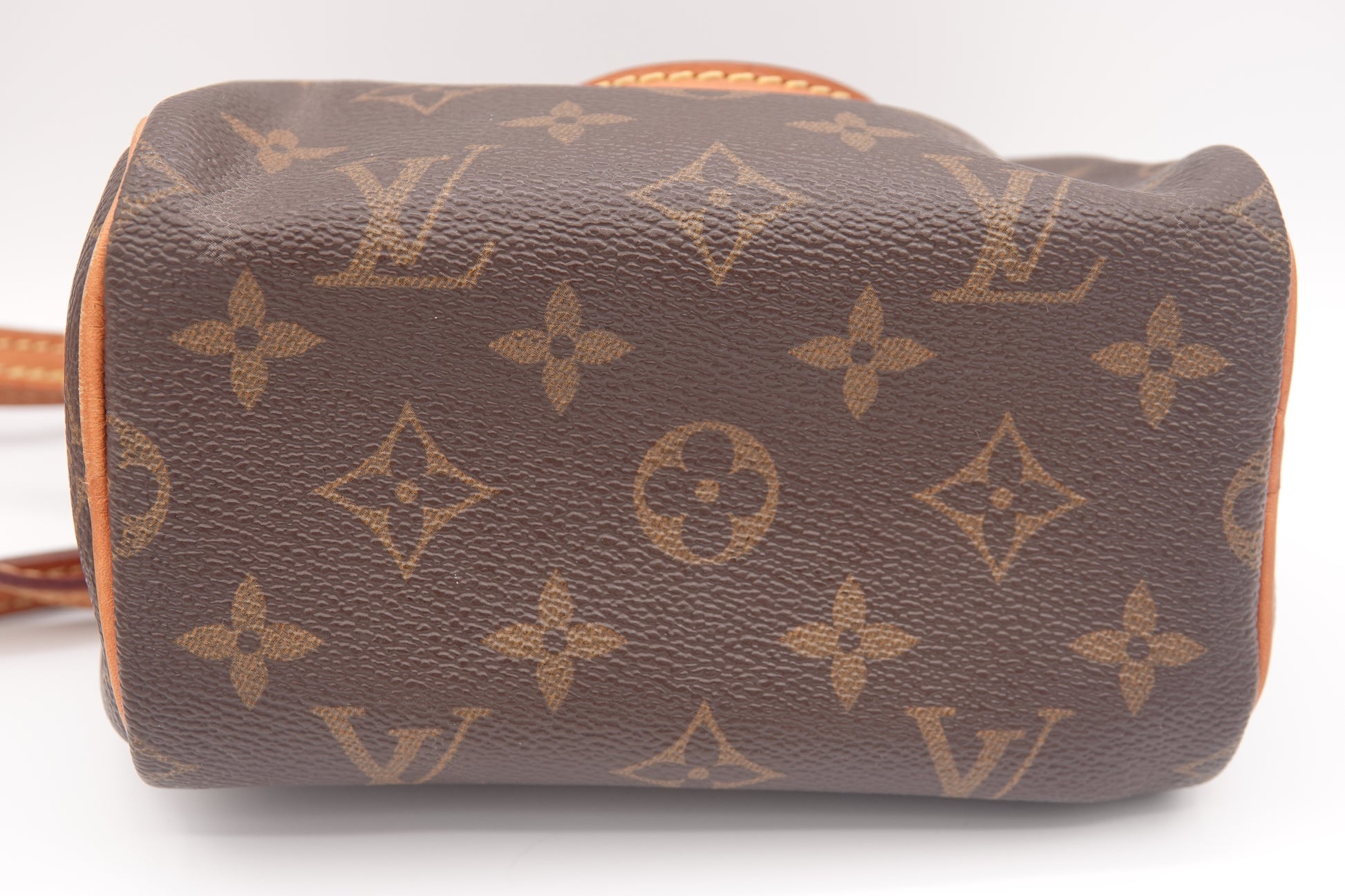 Louis Vuitton monogram handbag on a white background
