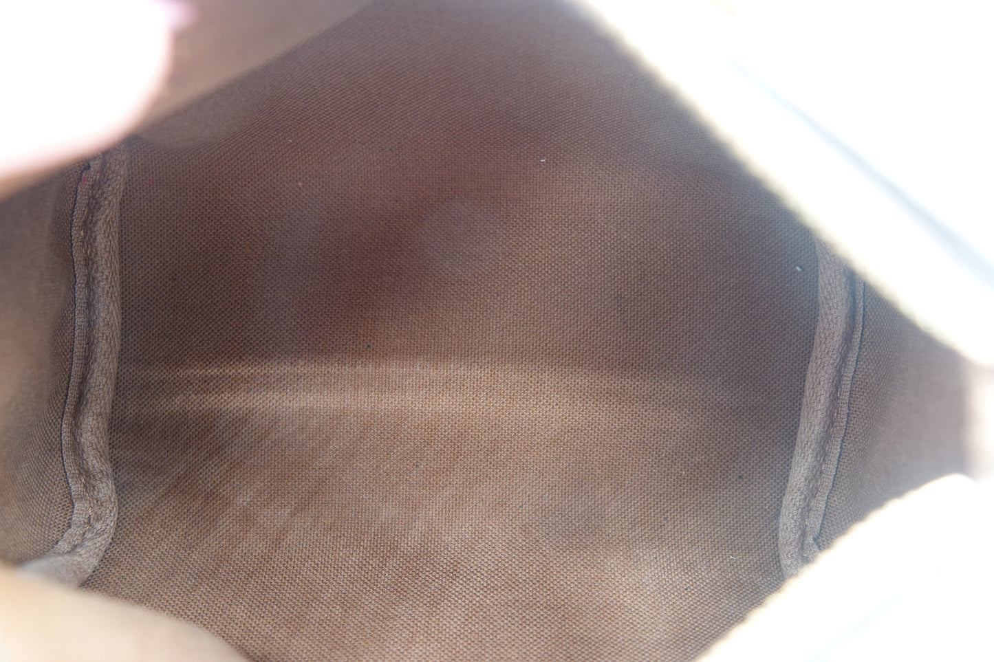 Close-up of a brown shoe sole with visible wear and tear.