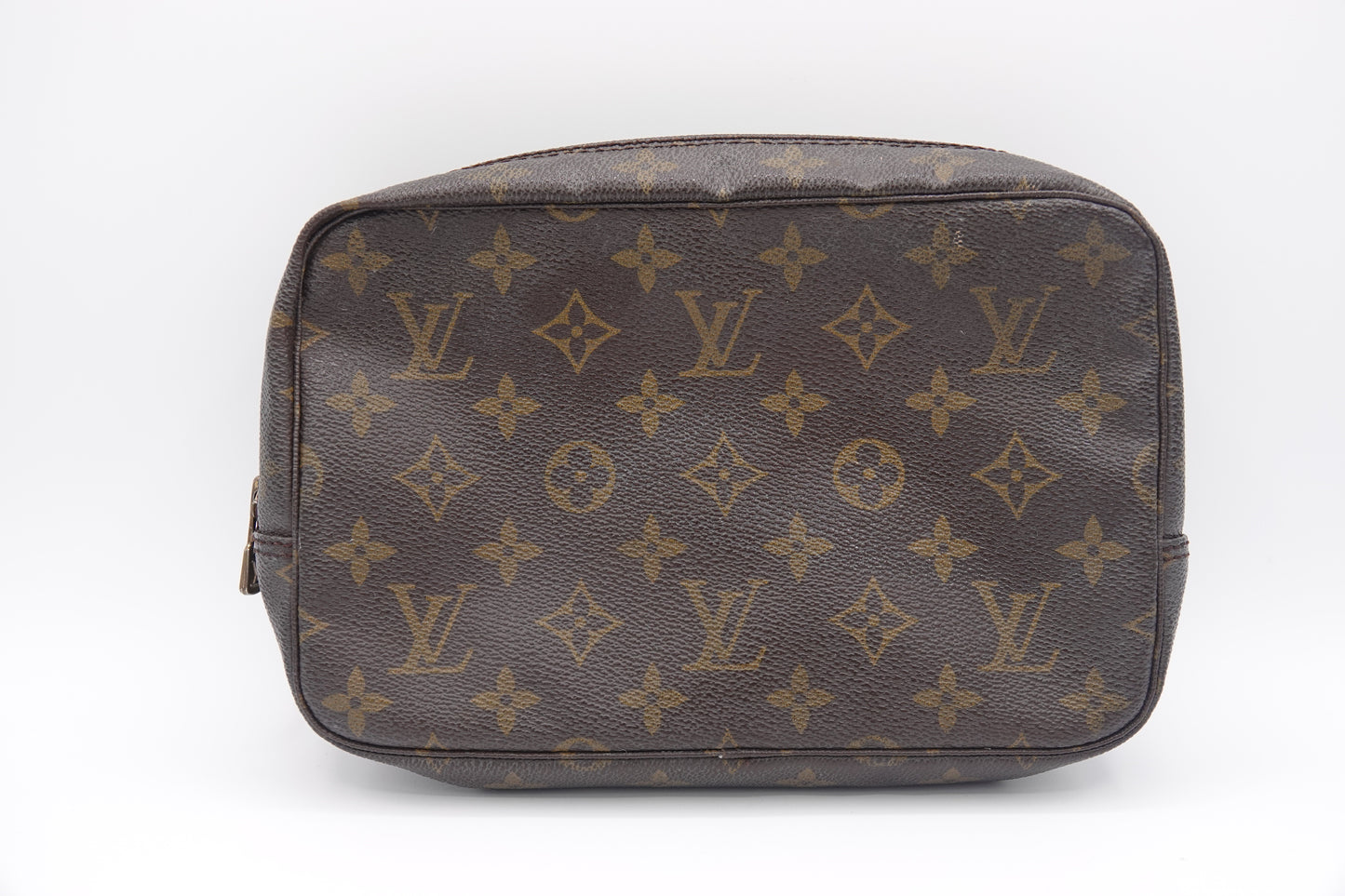 Brown Louis Vuitton bag with monogram pattern on a white background
