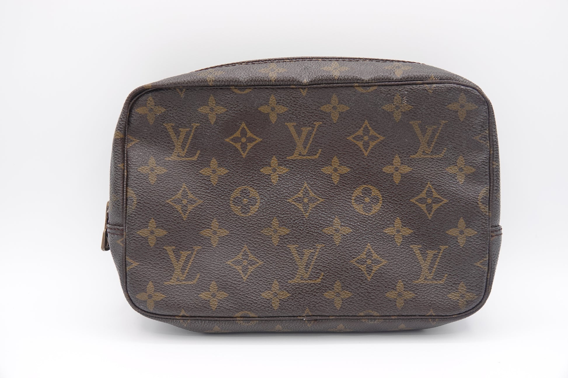 Brown Louis Vuitton bag with monogram pattern on a white background